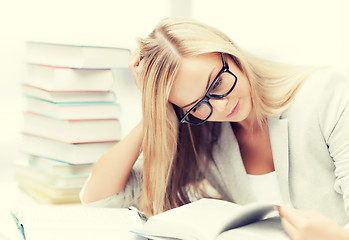 Image showing student with books and notes