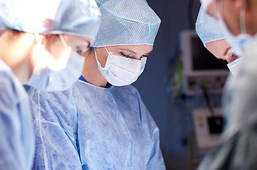 Image showing group of surgeons in operating room at hospital