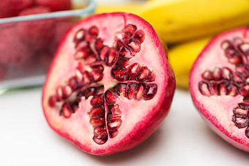 Image showing close up of ripe pomegranate and other fruits