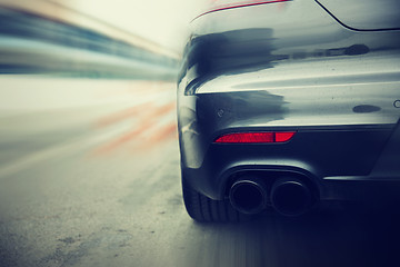 Image showing close up of car riding on highway from back