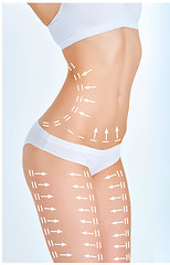 Image showing The cellulite removal plan. White markings on young woman body 