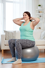 Image showing plus size woman exercising with fitness ball