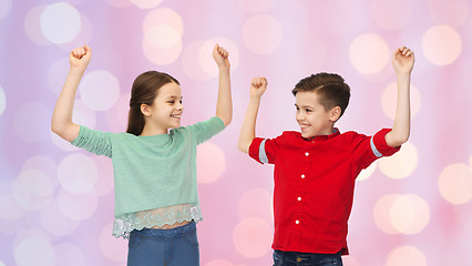 Image showing happy boy and girl celebrating victory