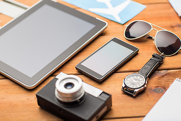 Image showing close up of smartphone and travel stuff