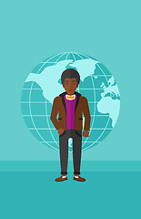 Image showing Businessman standing on globe background.