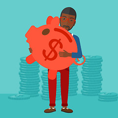 Image showing Man carrying piggy bank.