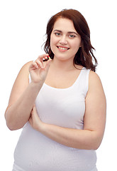 Image showing happy plus size woman in underwear with pill