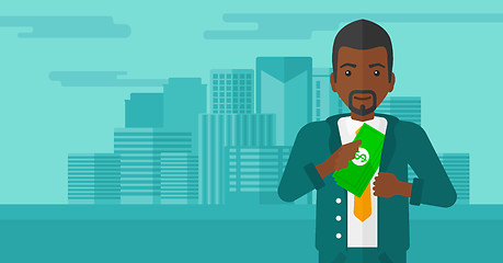Image showing Man putting money in pocket.