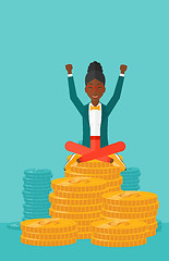 Image showing  Happy business woman sitting on coins.