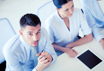 Image showing serious businessman on meeting in office