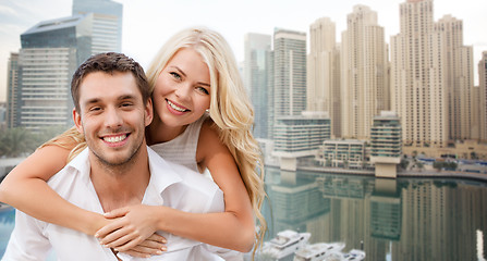 Image showing happy couple having fun over dubai city background