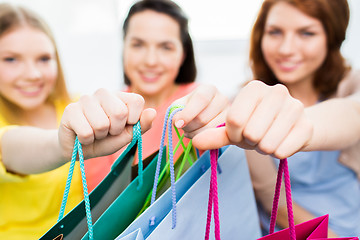 Image showing close up of happy teenage girls with shopping bags