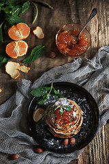 Image showing The natural mandarin jam on wooden table