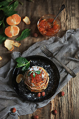 Image showing The natural mandarin jam on wooden table