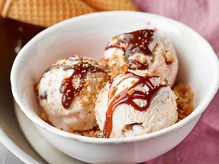 Image showing bowl of ice cream with chocolate sauce