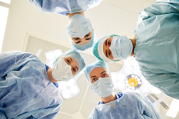 Image showing group of surgeons in operating room at hospital