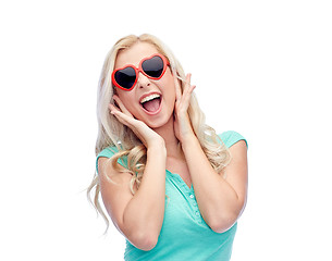 Image showing happy young woman in heart shape sunglasses