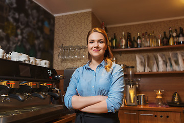 Image showing happy barista woman at coffee shop