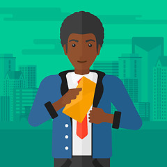 Image showing Man putting envelope in pocket.