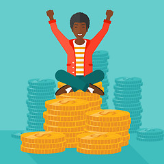 Image showing  Happy businessman sitting on coins.