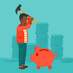 Image showing Man breaking piggy bank.