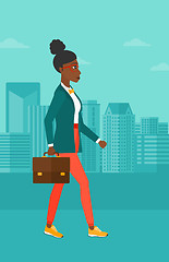 Image showing Business woman walking with briefcase. 