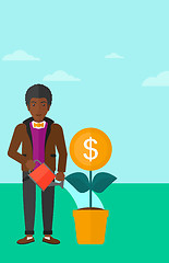 Image showing Man watering money flower.