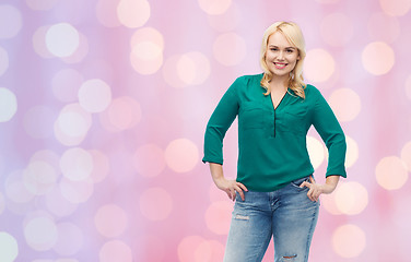 Image showing smiling young woman in shirt and jeans