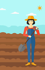 Image showing Farmer on the field with shovel.