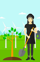 Image showing Woman plants tree.