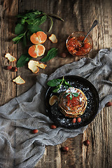 Image showing The natural mandarin jam on wooden table