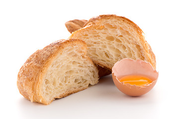 Image showing Croissant and raw egg