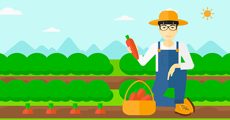 Image showing Farmer collecting carrots.