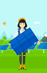 Image showing Woman holding solar panel.