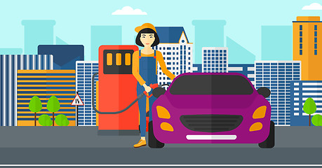 Image showing Woman filling up fuel into car.