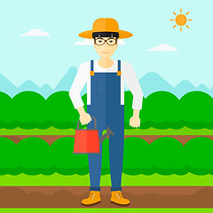 Image showing Farmer with watering can.