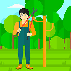 Image showing Farmer with pruner in garden.