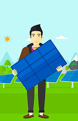 Image showing Man holding solar panel.