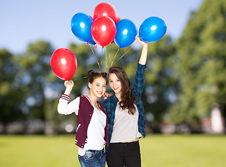 Image showing happy teenage girls with helium balloons