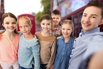 Image showing happy children talking selfie over london city