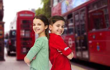 Image showing happy boy and girl standing over london city