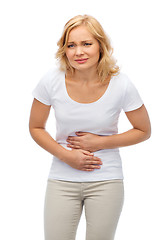 Image showing unhappy woman suffering from stomach ache