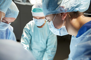 Image showing group of surgeons in operating room at hospital