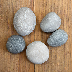 Image showing stones on wooden background