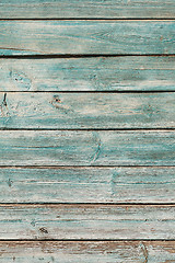 Image showing Old blue cracked paint on wooden background