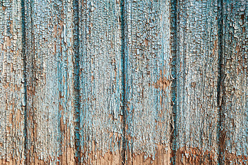 Image showing Old blue cracked paint on wooden background