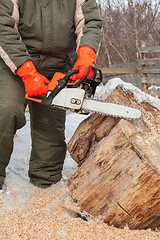 Image showing Carpenter working at sawmill 