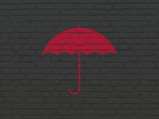 Image showing Security concept: Umbrella on wall background