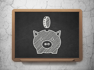 Image showing Banking concept: Money Box With Coin on chalkboard background