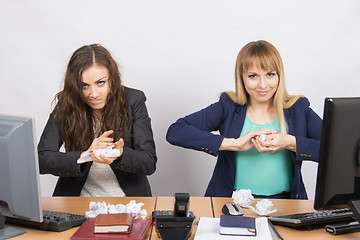 Image showing Employees of office paper crumpling up to something